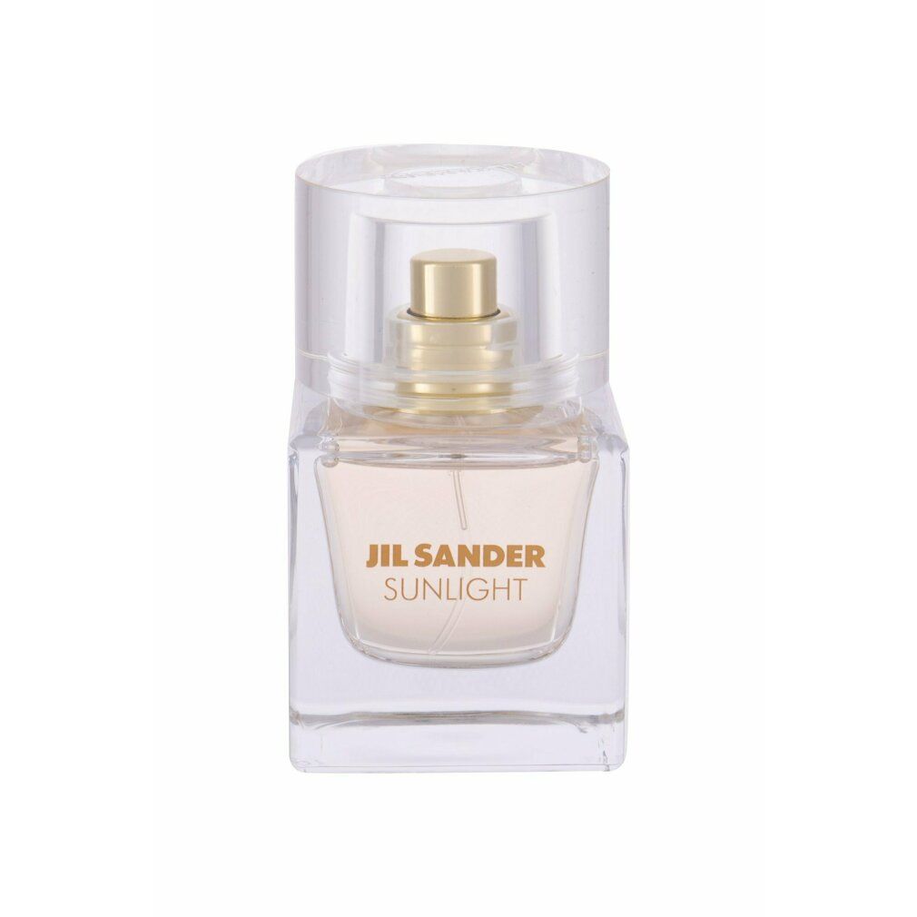 Flacone di profumo Jil Sander Sunlight. Piccolo flacone quadrato in vetro con vaporizzatore e tappo dorati. Scritta Sunlight.