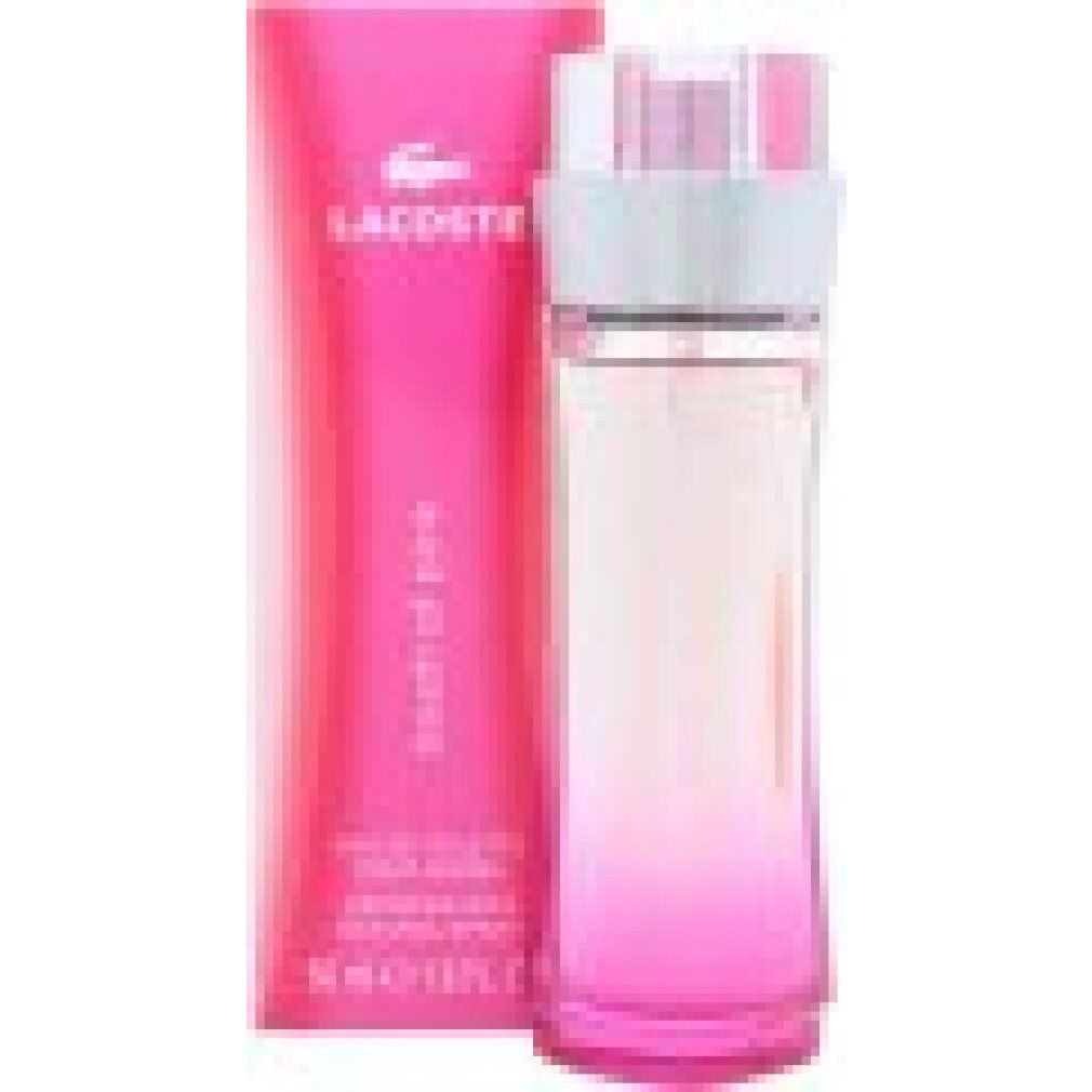 Flacone e confezione Lacoste Touch of Pink Eau de Toilette. Gradiente rosa su bottiglia e scatola.