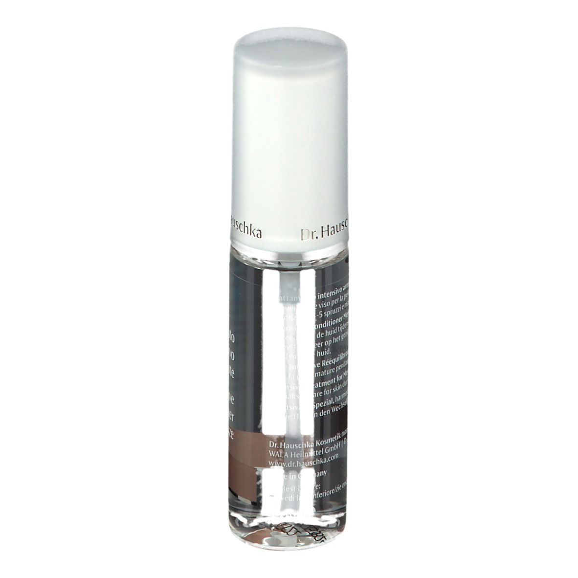Flacone trasparente con vaporizzatore. Tappo bianco. Nome del prodotto e testo sul flacone. Striscia marrone in basso.