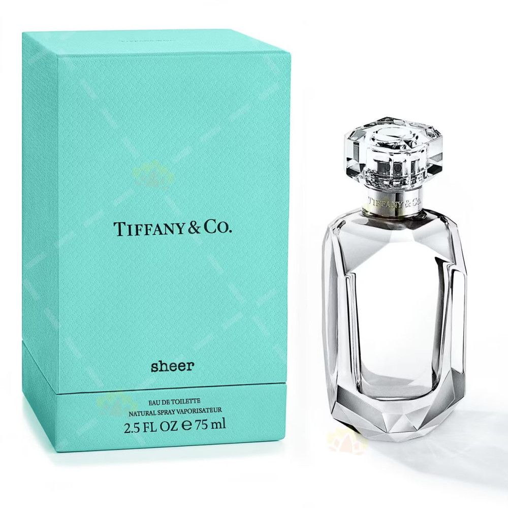 Scatola turchese e flacone di profumo. Sulla scatola "Tiffany & Co." e "sheer". Il flacone è trasparente.