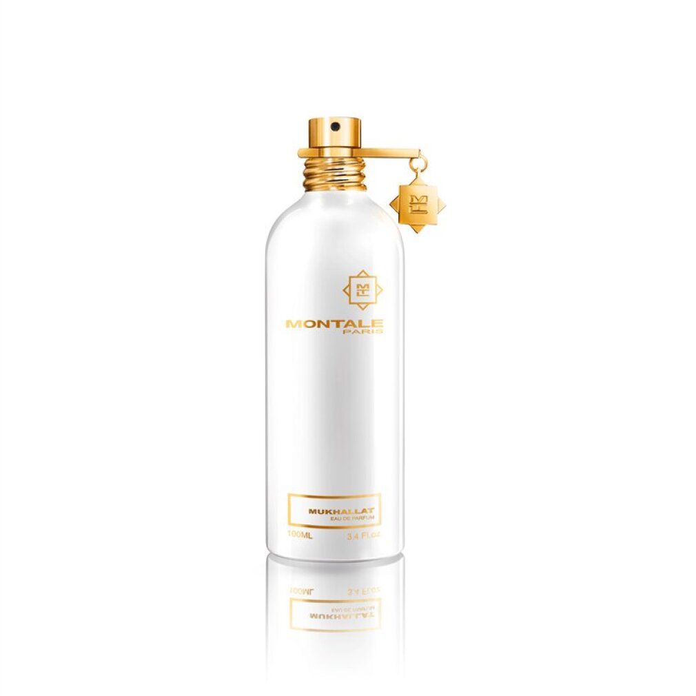 Flacone di profumo bianco con dettagli dorati. Scritta: Montale Paris, Mukhallat Eau de Parfum.