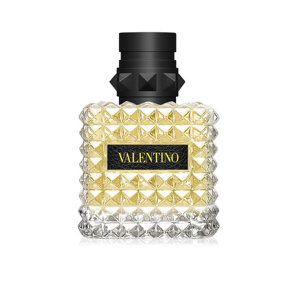 Valentino Donna Born In Roma Yellow Dream Eau de Parfum. Flacone quadrato con borchie. Tappo nero. Etichetta nera con testo.