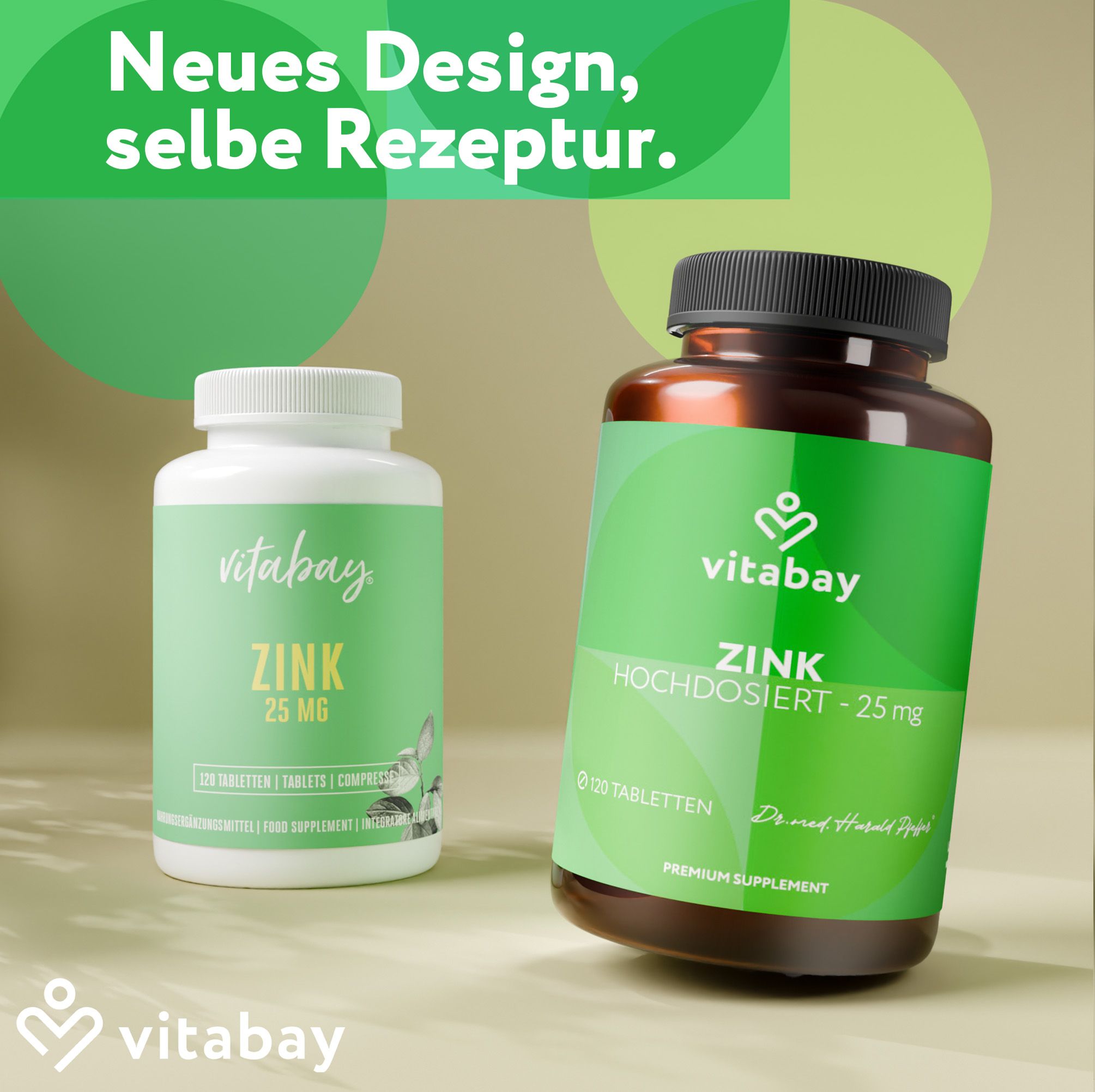 Due bottiglie Vitabay Zink 25mg. Una bianca e una marrone. Testo: Nuovo design, stessa ricetta.