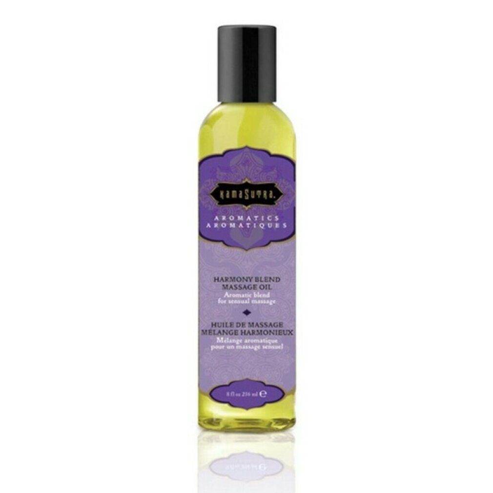 Flacone giallo con tappo nero. Etichetta viola con testo: "Kamasutra Aromatics Harmony Blend Massage Oil". 4 fl oz.