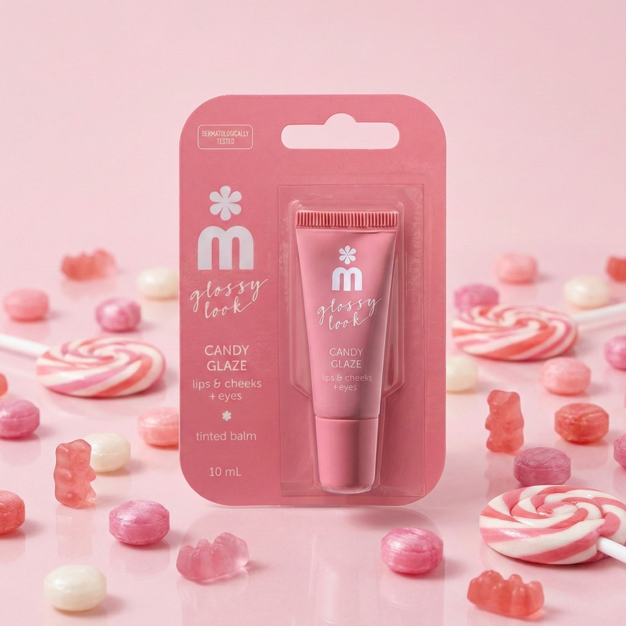 Confezione rosa con tubo. Nome del prodotto: Candy Glaze, per labbra, guance e palpebre. Decorazione di caramelle.