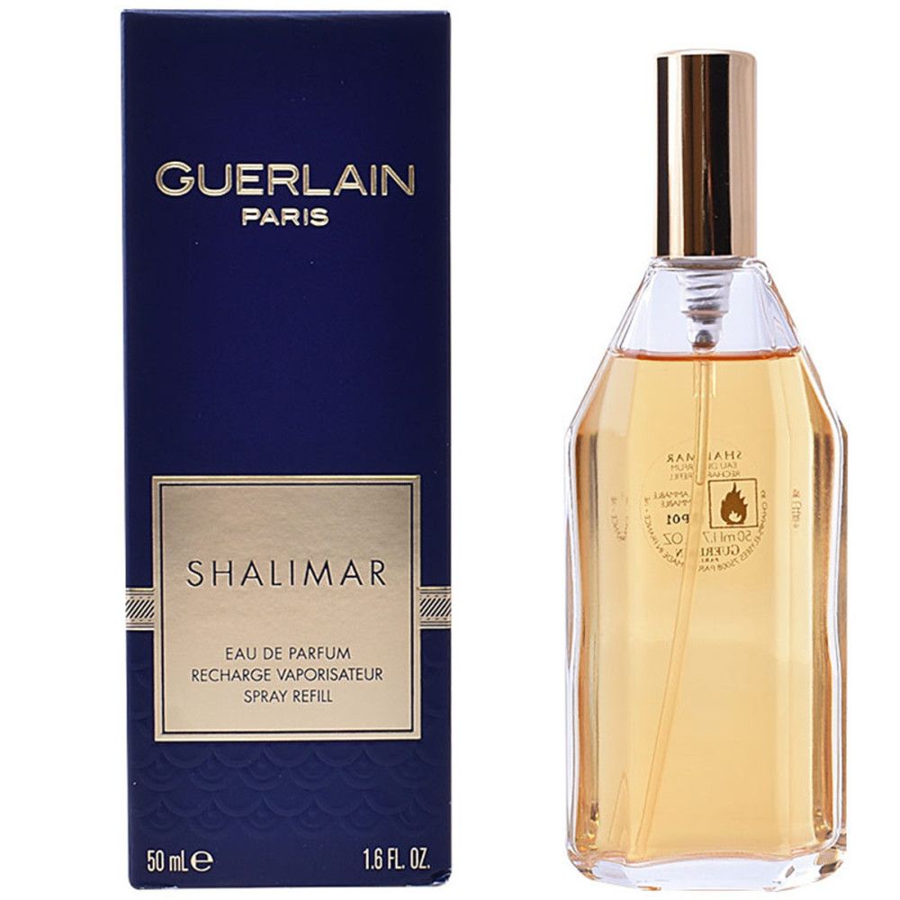 Scatola blu scuro e flacone. GUERLAIN PARIS e SHALIMAR sulla scatola. Flacone trasparente con tappo dorato.