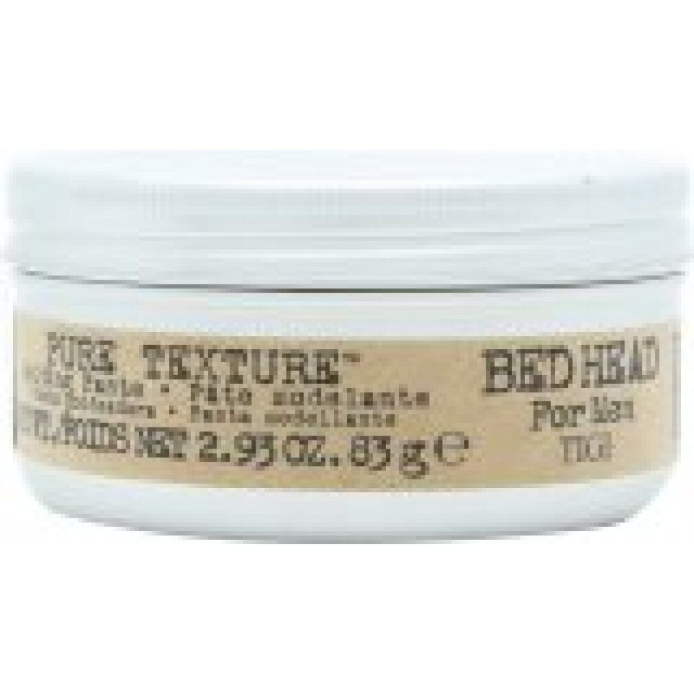 Barattolo bianco con coperchio bianco. Etichetta marrone con "PURE TEXTURE" e "Bed Head For Men TIGI". Testo in inglese, spagnolo e francese.