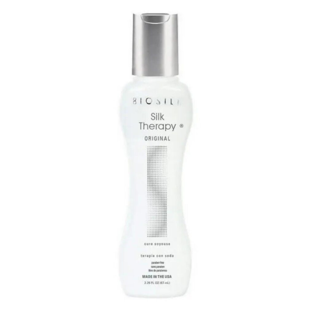 Flacone bianco con tappo argentato. Scritta BIOSILK Silk Therapy ORIGINAL. Forma a clessidra. Testo in basso.