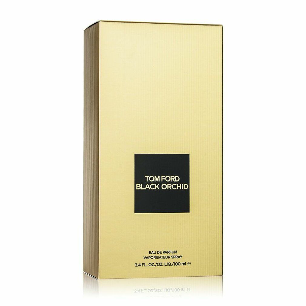 Confezione dorata con logo nero. Testo: Tom Ford Black Orchid. Sotto: Eau de Parfum, Vaporisateur Spray, 3.4 FL. OZ./100 ml e.