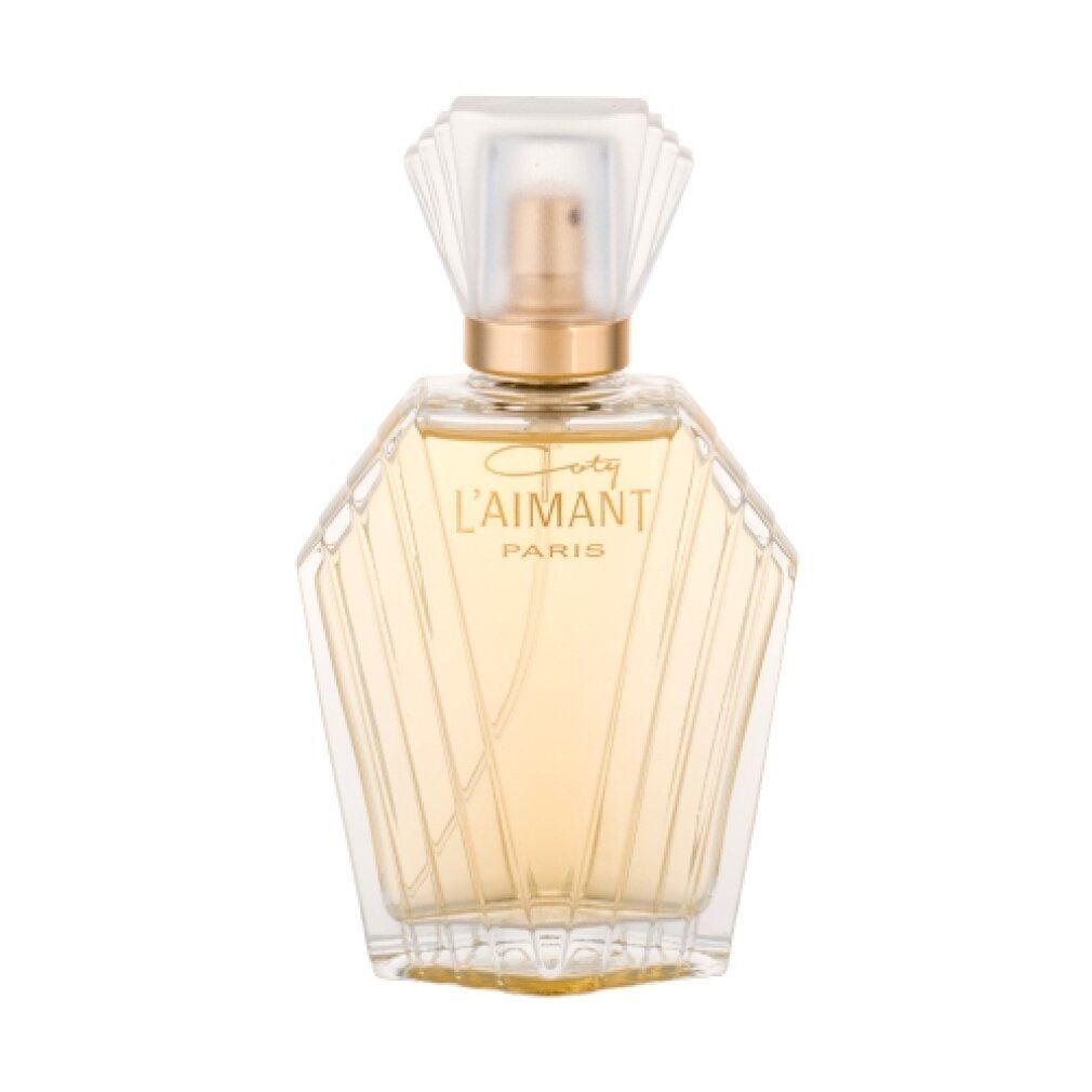 Flacone di profumo Coty L'Aimant. Flacone in vetro trasparente con vaporizzatore e tappo dorati. Scritta.
