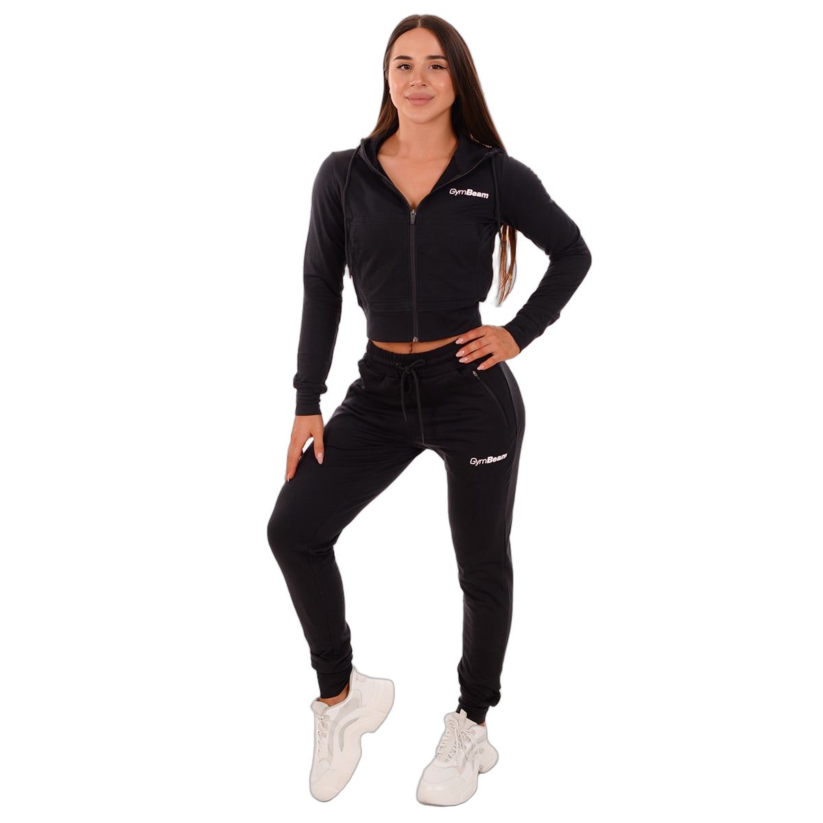 Donna con pantaloni da jogging neri e felpa con cappuccio GymBeam, con coulisse e tasche con zip.