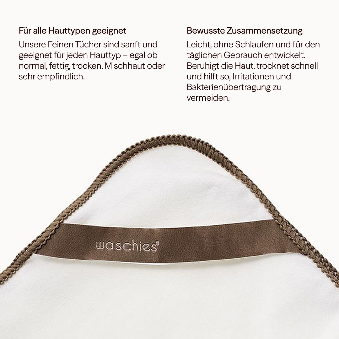 Asciugamano bianco con bordo marrone e logo. Testo: waschies.