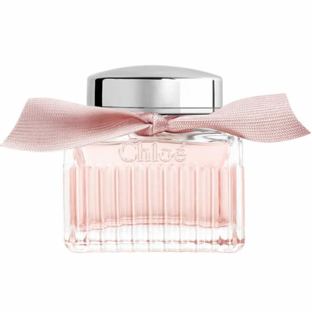 Flacone quadrato in vetro con tappo argentato e fiocco rosa. Il flacone contiene un liquido rosa.