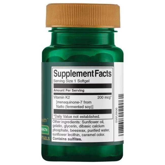 Retro di un flacone verde con tappo marrone. Etichetta con informazioni nutrizionali. Contiene vitamina K2.