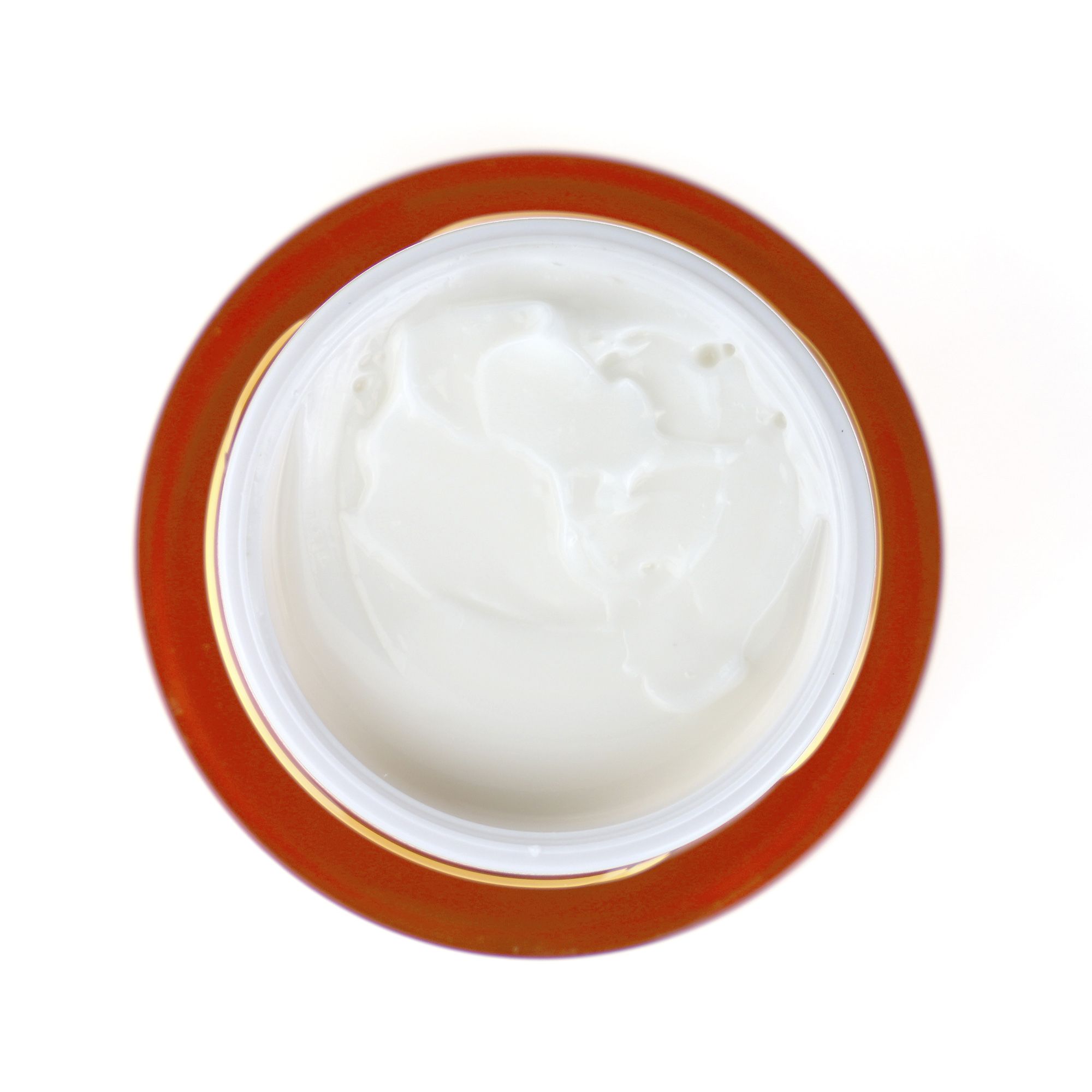 Vista dall'alto di un vaso di crema aperto. Crema visibile. Scritta: PostQuam, Re-Nergie C.