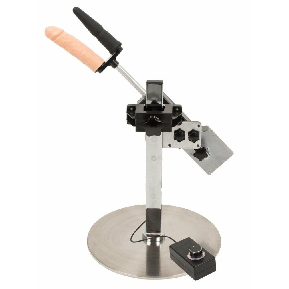 Dispositivo con base metallica, asta, supporto e due accessori. Un accessorio è nero, l'altro color carne. Cavi e controllo.