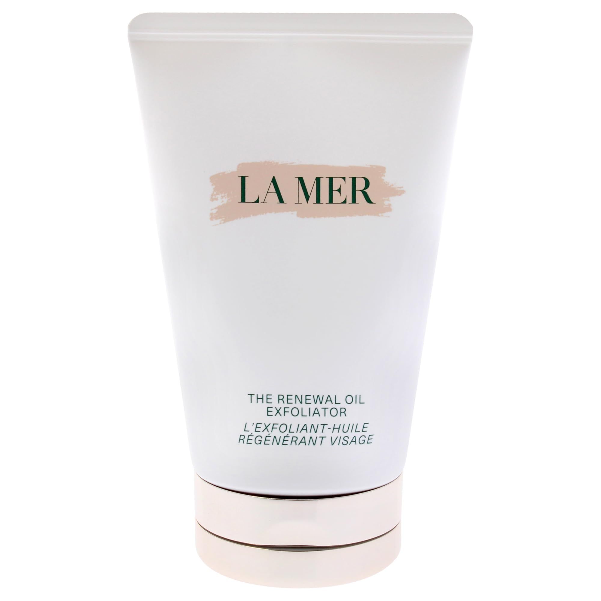Tubo bianco con base dorata. Scritta: LA MER, THE RENEWAL OIL EXFOLIATOR, L'EXFOLIANT-HUILE RÉGÉNÉRANT VISAGE.