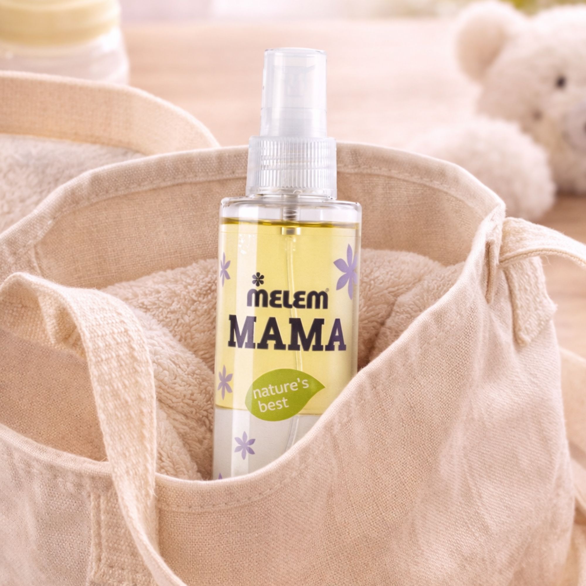 Olio bifasico MELEM Mama in una borsa di stoffa con asciugamani.