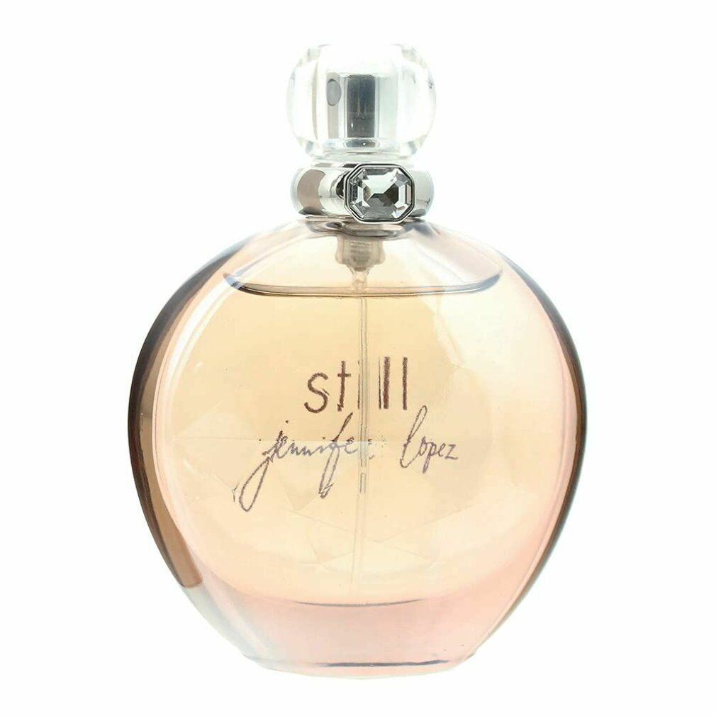 Flacone di profumo rotondo, marrone chiaro. Scritta "still jennifer lopez". Chiusura trasparente.