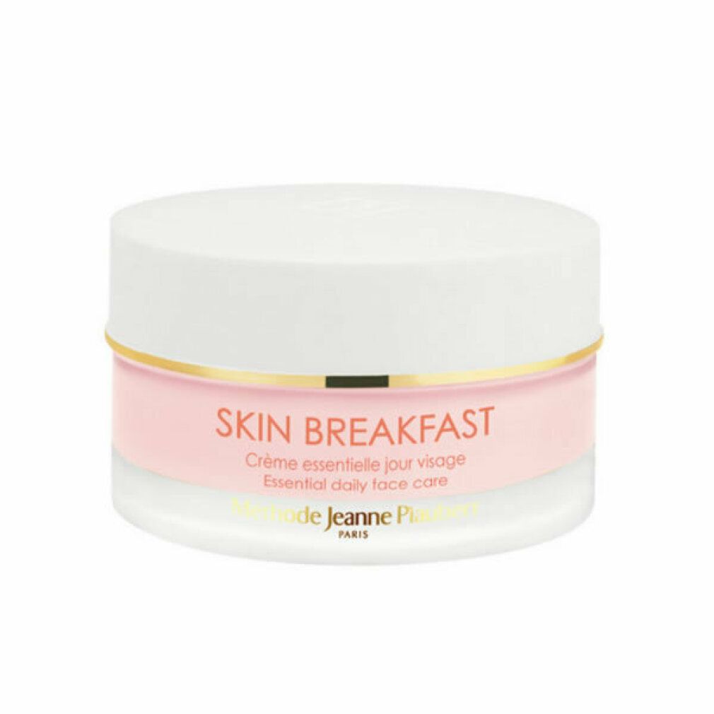 Vasetto di crema con coperchio bianco e contenuto rosa. Anello dorato. Scritta SKIN BREAKFAST.