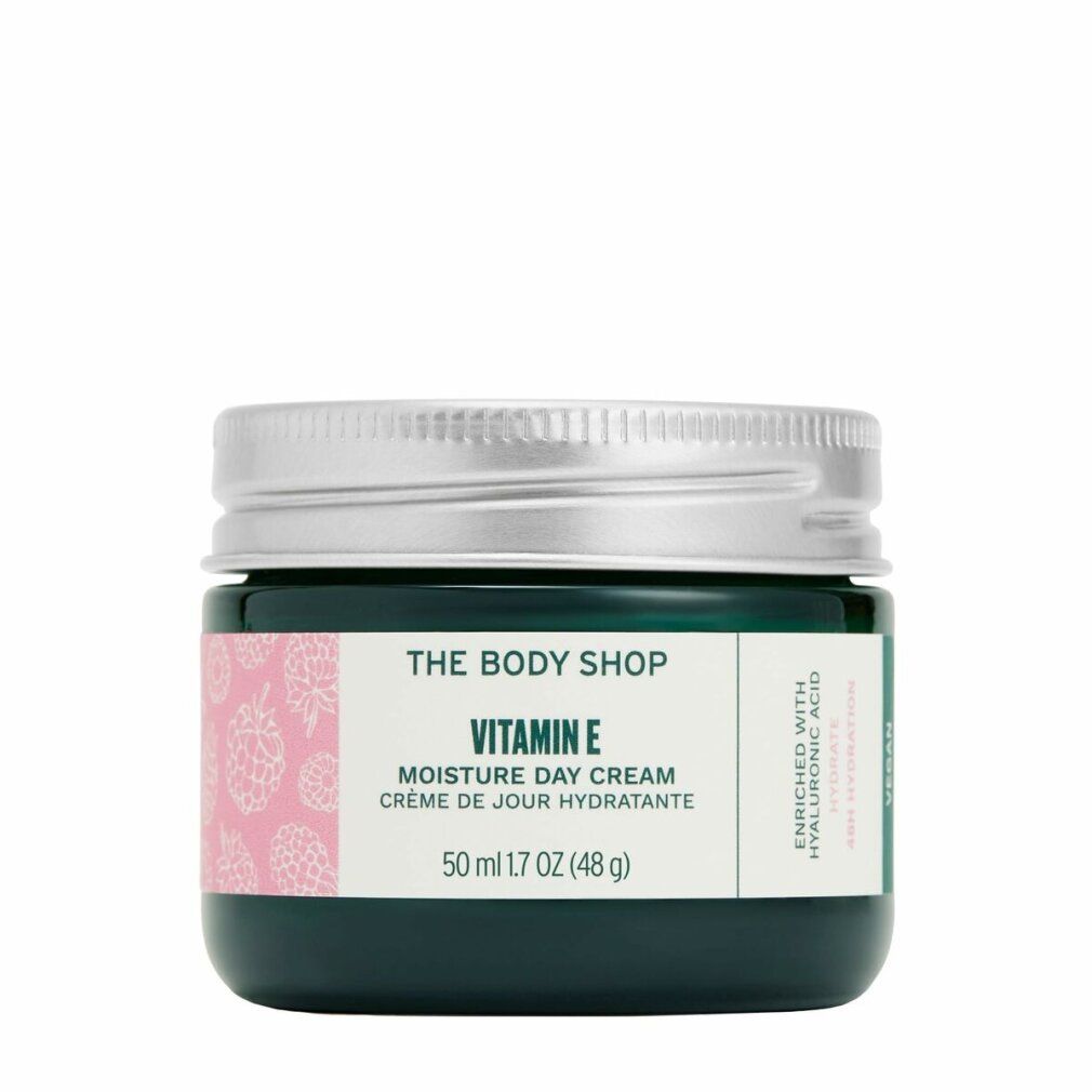 Vaso di vetro verde scuro con coperchio argentato. Etichetta "Vitamin E Moisture Day Cream" e "The Body Shop". Motivo rosa. 50 ml.
