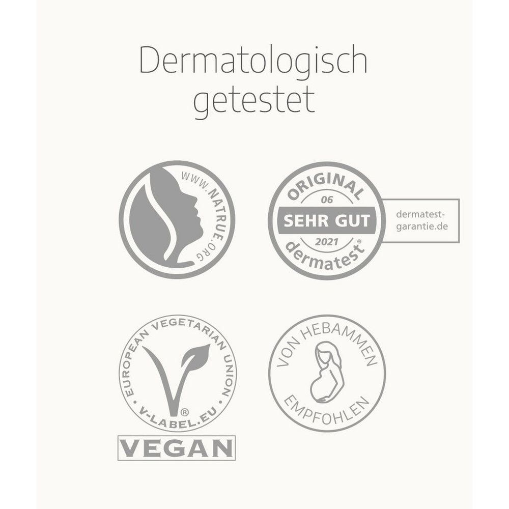 Vari loghi e sigilli. Tra cui: Natrue, Dermatest, Vegan e Consigliato dalle ostetriche. Testo: Dermatologicamente testato.