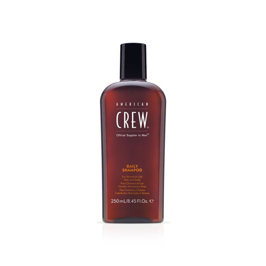 Flacone marrone American Crew Daily Shampoo. Tappo nero. Testo: Daily Shampoo, 250ml/8.45 Fl. Oz.