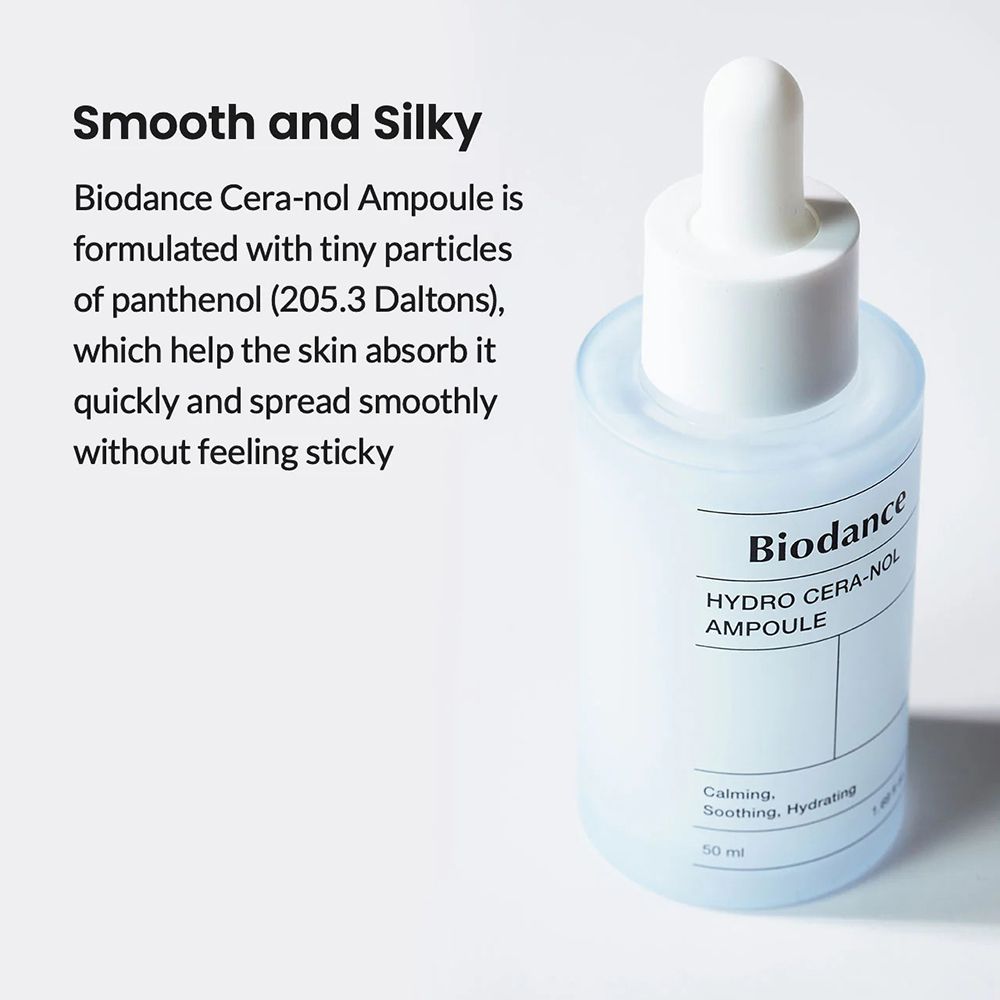 Flacone con tappo e pipetta bianchi. Scritta: Biodance, HYDRO CERA-NOL, AMPULE. Testo: Smooth and Silky. Ambiente luminoso.