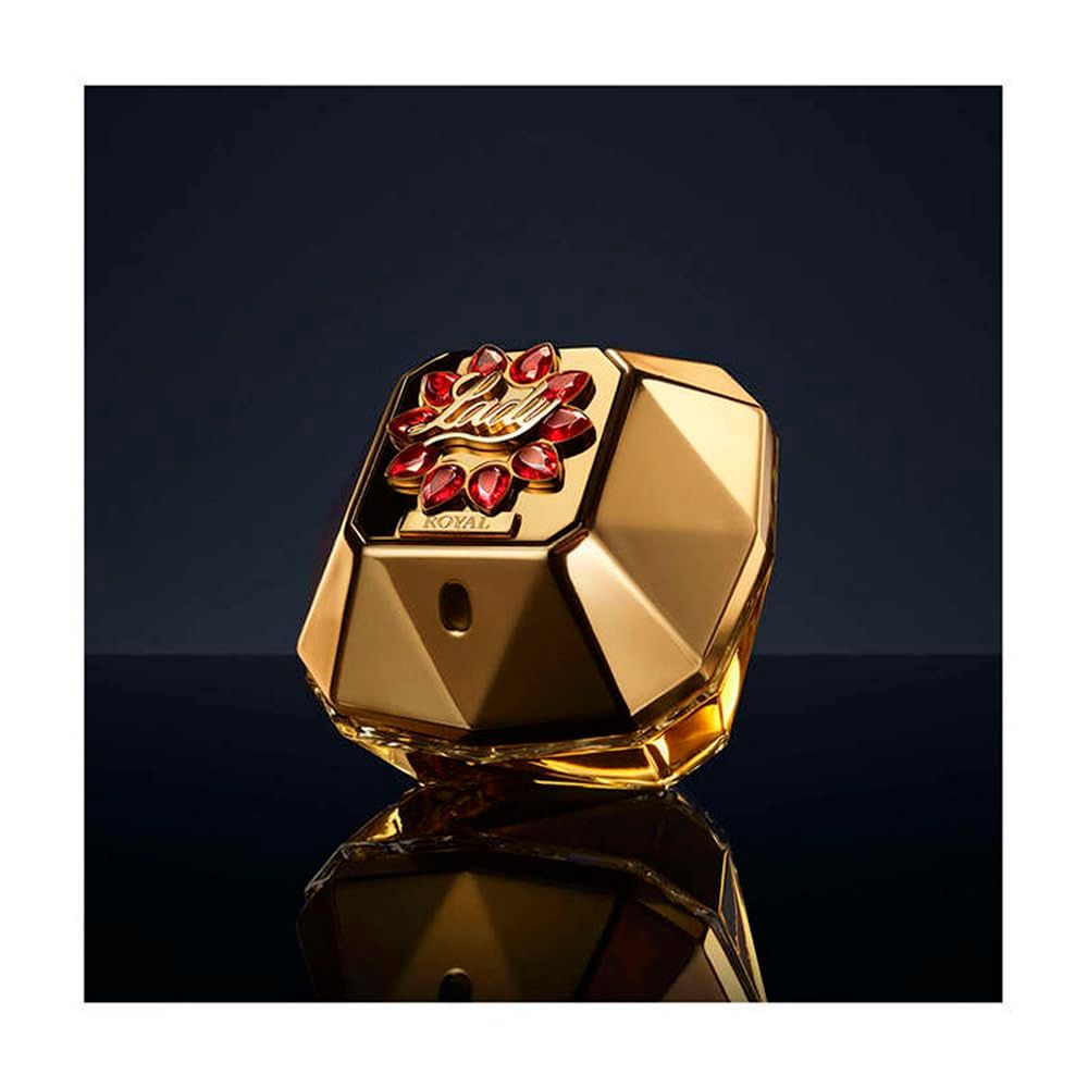 Flacone di profumo dorato con pietre rosse. Scritta: ROYAL.