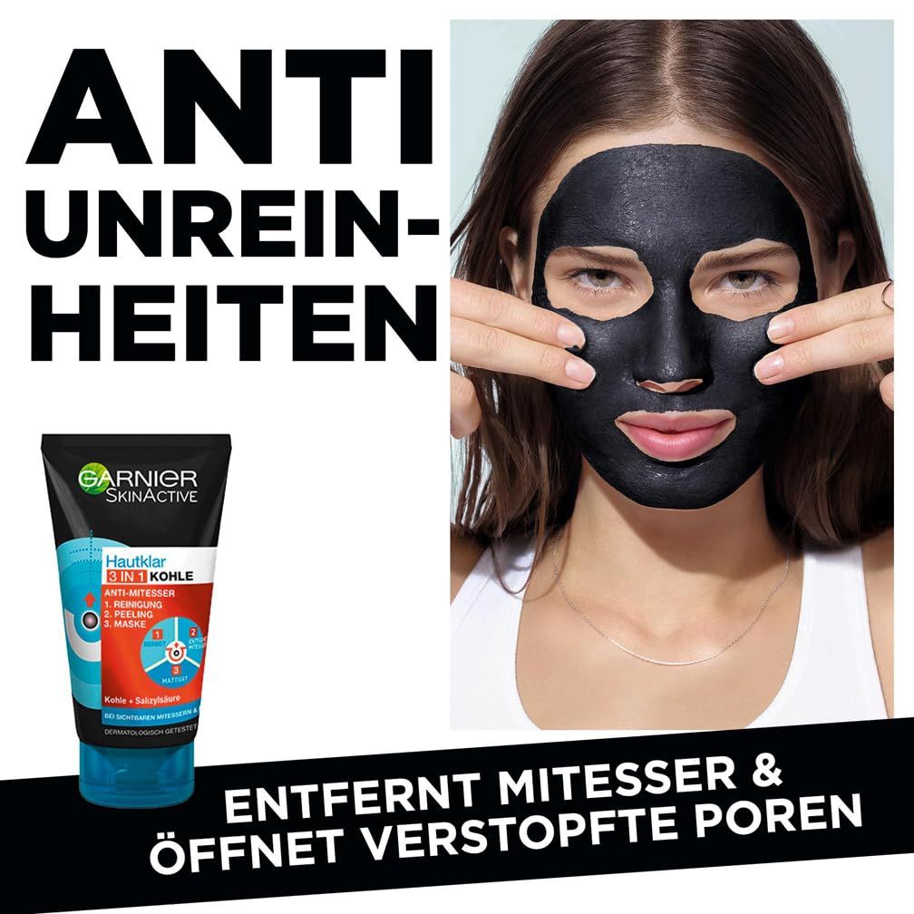 Donna con maschera nera sul viso. Garnier SkinActive Hautklar Kohle Maschera peel-off anti-punti neri. Testo: Anti-imperfezioni.