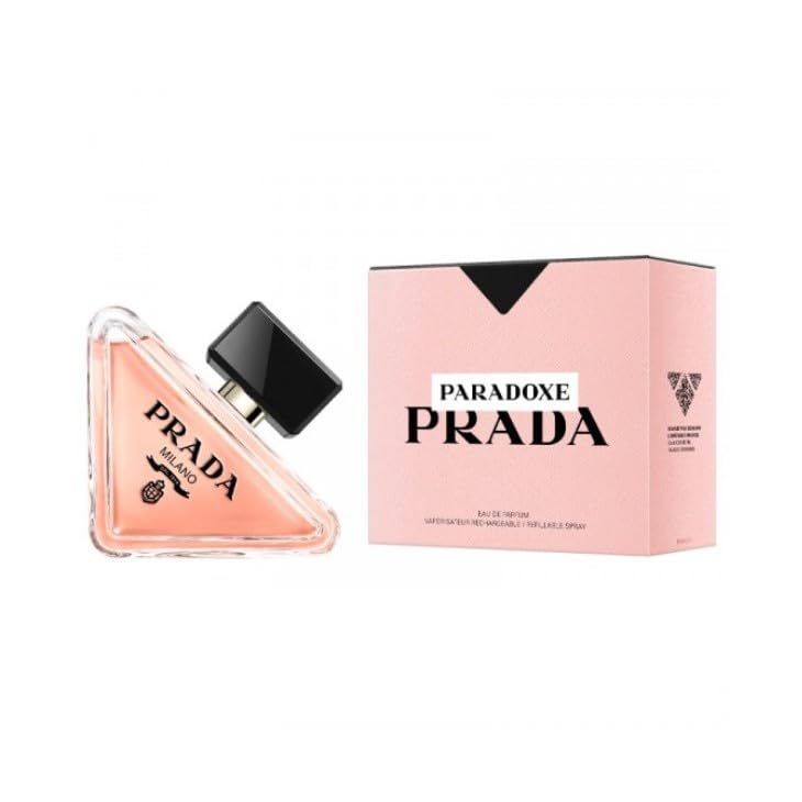 Flacone di profumo rosa e confezione. Tappo nero. Scritta PARADOXE PRADA.