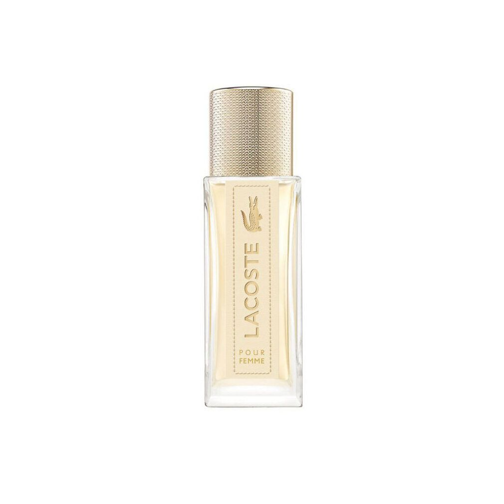 Flacone di profumo con tappo dorato. L'etichetta riporta "Lacoste Pour Femme".
