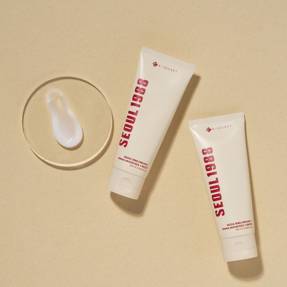 Due tubi di SEOUL 1988 Cream, uno con un campione su un bicchiere.