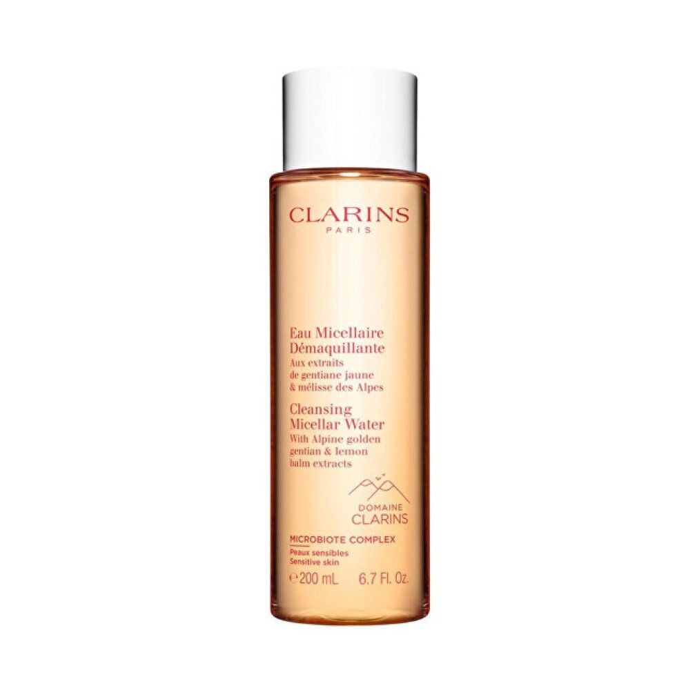 Flacone Clarins Eau Micellaire Démaquillante. Liquido trasparente, tappo bianco. Testo: Cleansing Micellar Water.