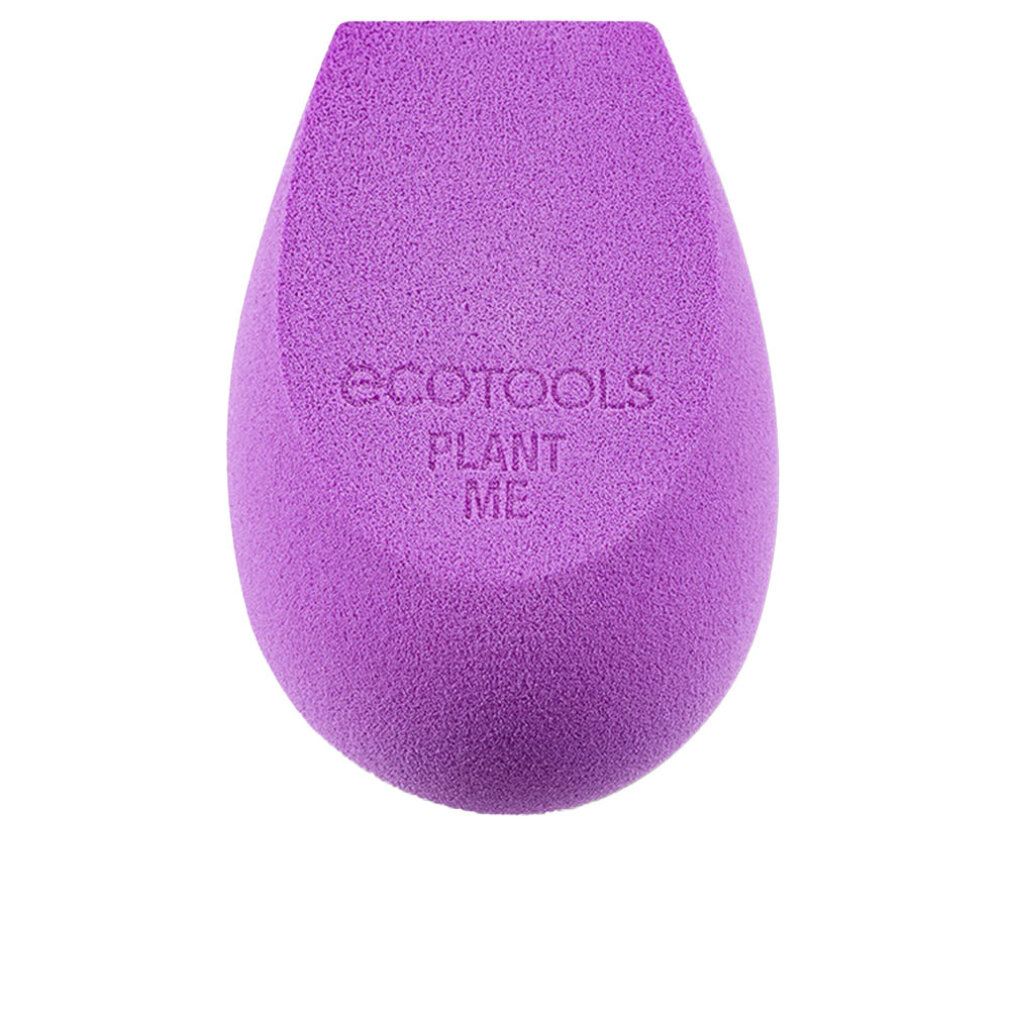 Spugna per trucco viola a goccia. Marchio 'Ecotools' e testo 'PLANT ME' sulla superficie. Sfondo bianco.