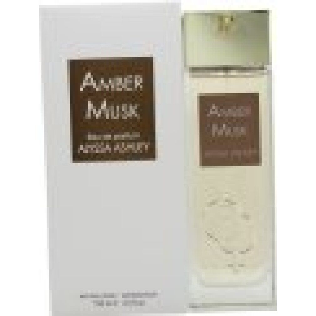 Flacone di profumo e confezione. Scritta "Amber Musk" e "Alyssa Ashley".