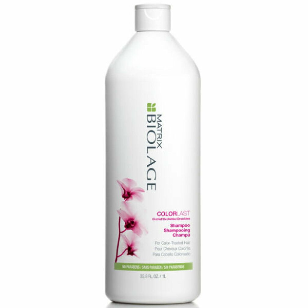 Flacone di shampoo bianco con logo Matrix Biolage ed etichetta Colorlast. Include un'illustrazione di un fiore rosa.