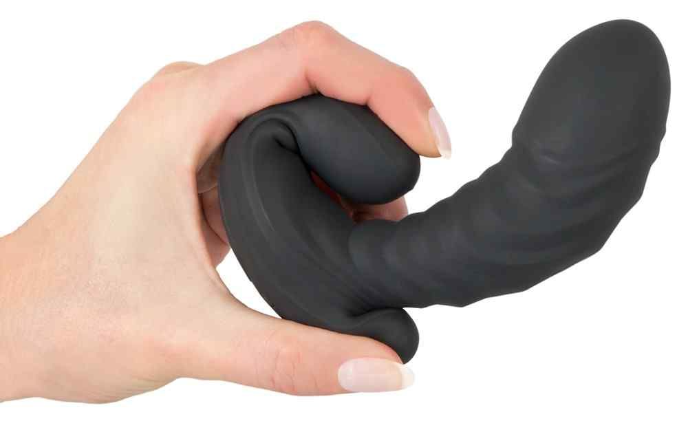 Mano che tiene un vibratore G&P Spot nero e flessibile.