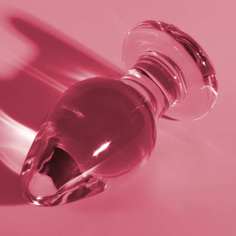 Plug anale in vetro rosa con base larga, lungo 11 cm, largo 5 cm.