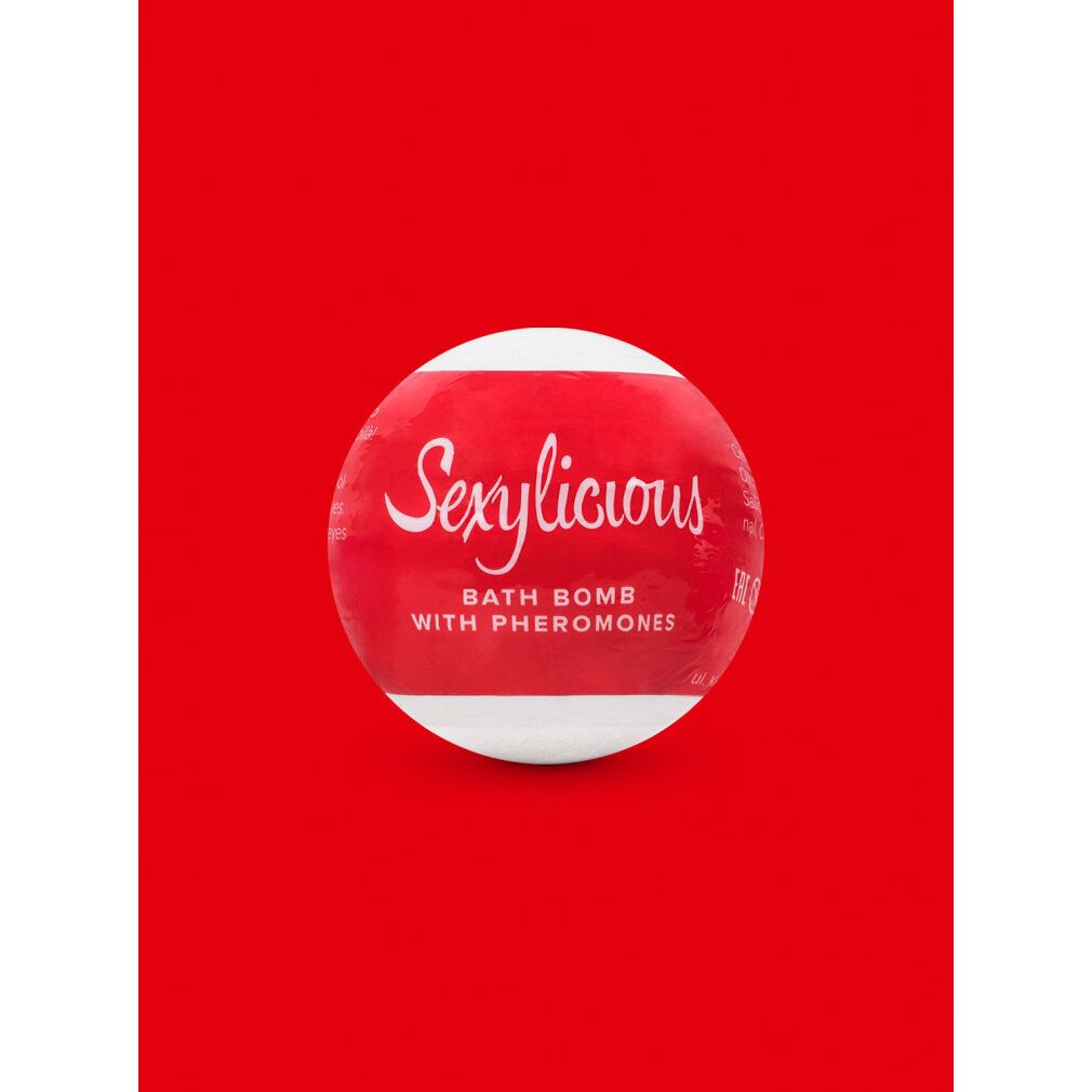 Bomba da bagno rossa con fascia bianca. Scritta: Sexylicious, Bath Bomb with Pheromones.
