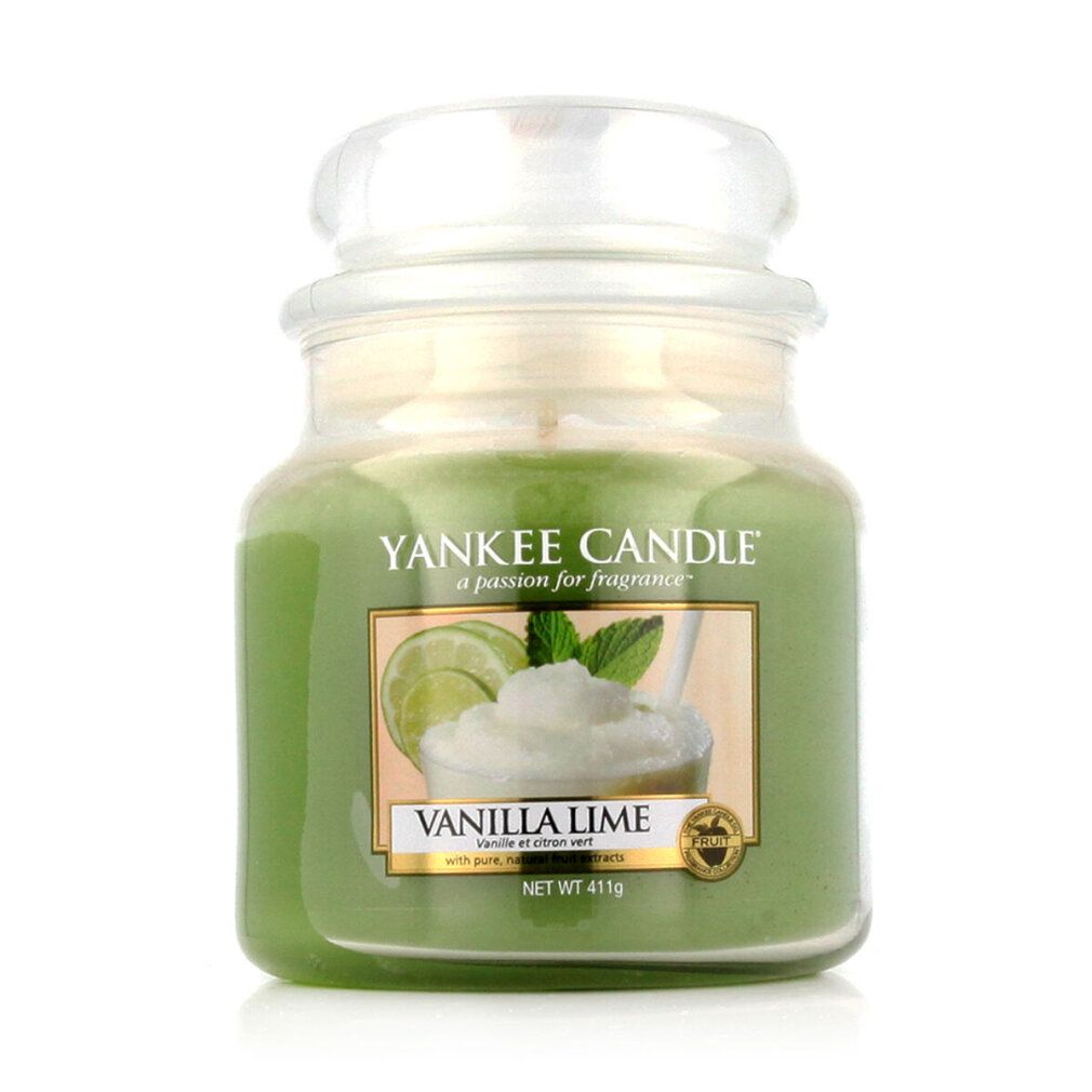 Candela verde in vaso con coperchio. Etichetta con motivo vaniglia-lime. Scritta: Vanilla Lime. Contenitore di vetro.