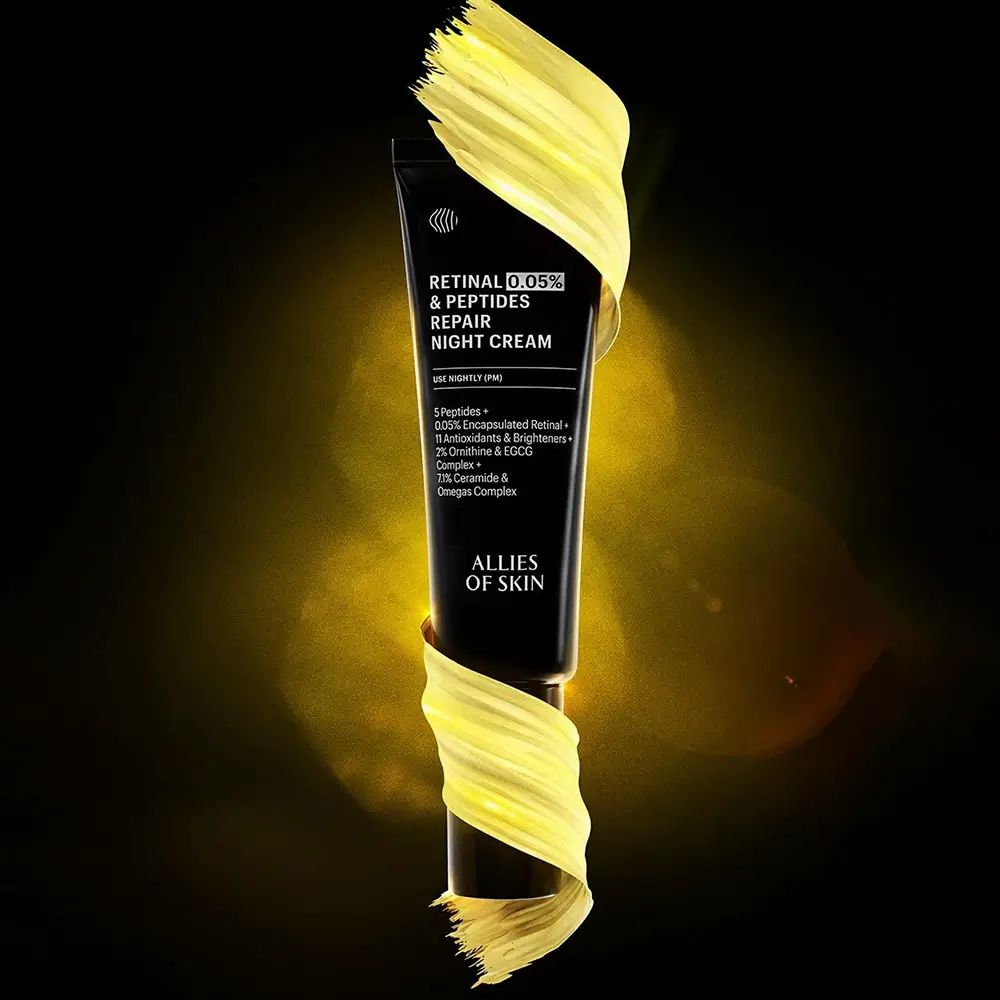 Tubo nero avvolto da crema gialla. Testo: Retinal 0,05% & Peptides Repair Night Cream. Marchio: ALLIES OF SKIN.