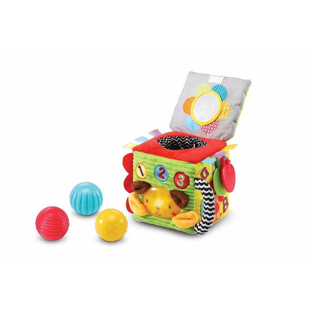 Cubo di stoffa con numeri, faccia di cane, specchio, nastri e palline. Colori: rosso, blu, giallo, verde.