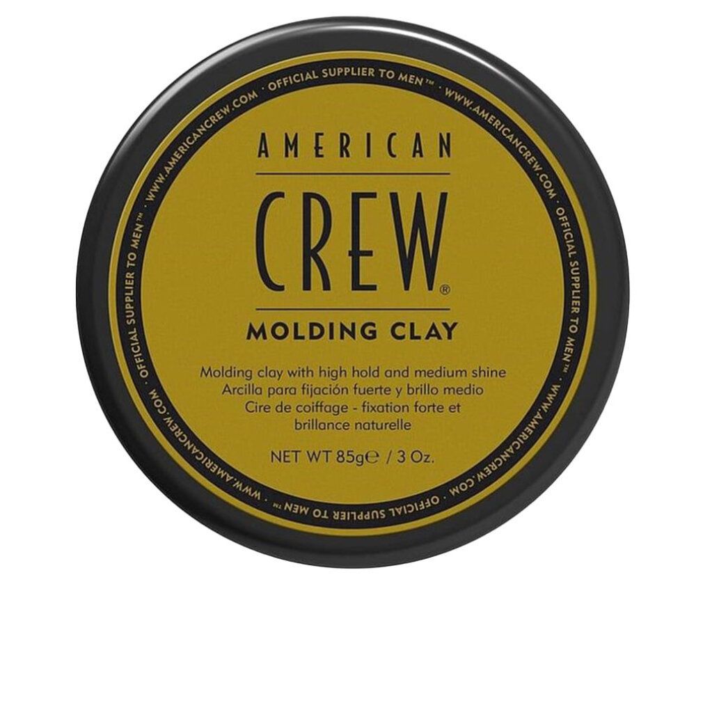 Barattolo rotondo nero. Scritta: American Crew Molding Clay. Sfondo dorato. Testo: Net Wt 85g/3 Oz.