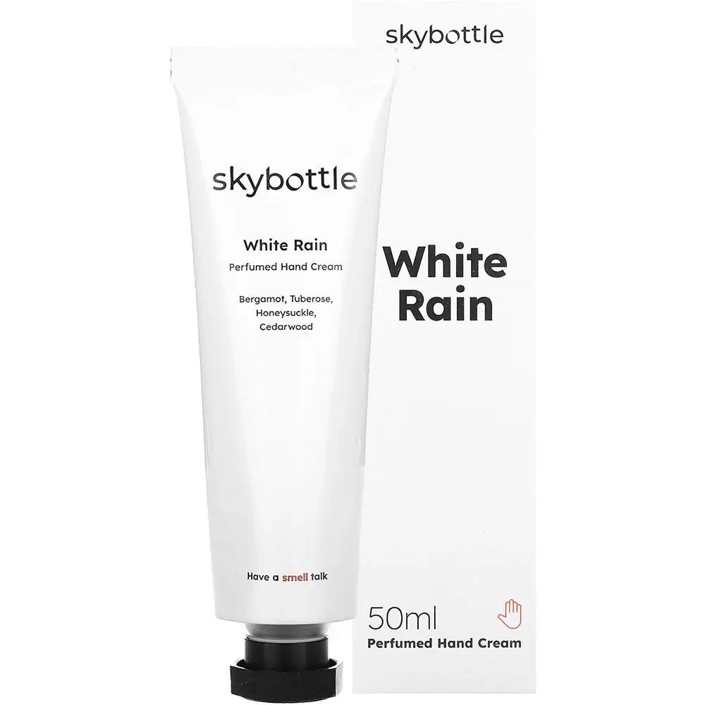 Tubo e scatola di crema mani bianca. Scritta: skybottle, White Rain, 50ml. Ingredienti: Bergamotto, Tuberosa, Caprifoglio, Legno di cedro.