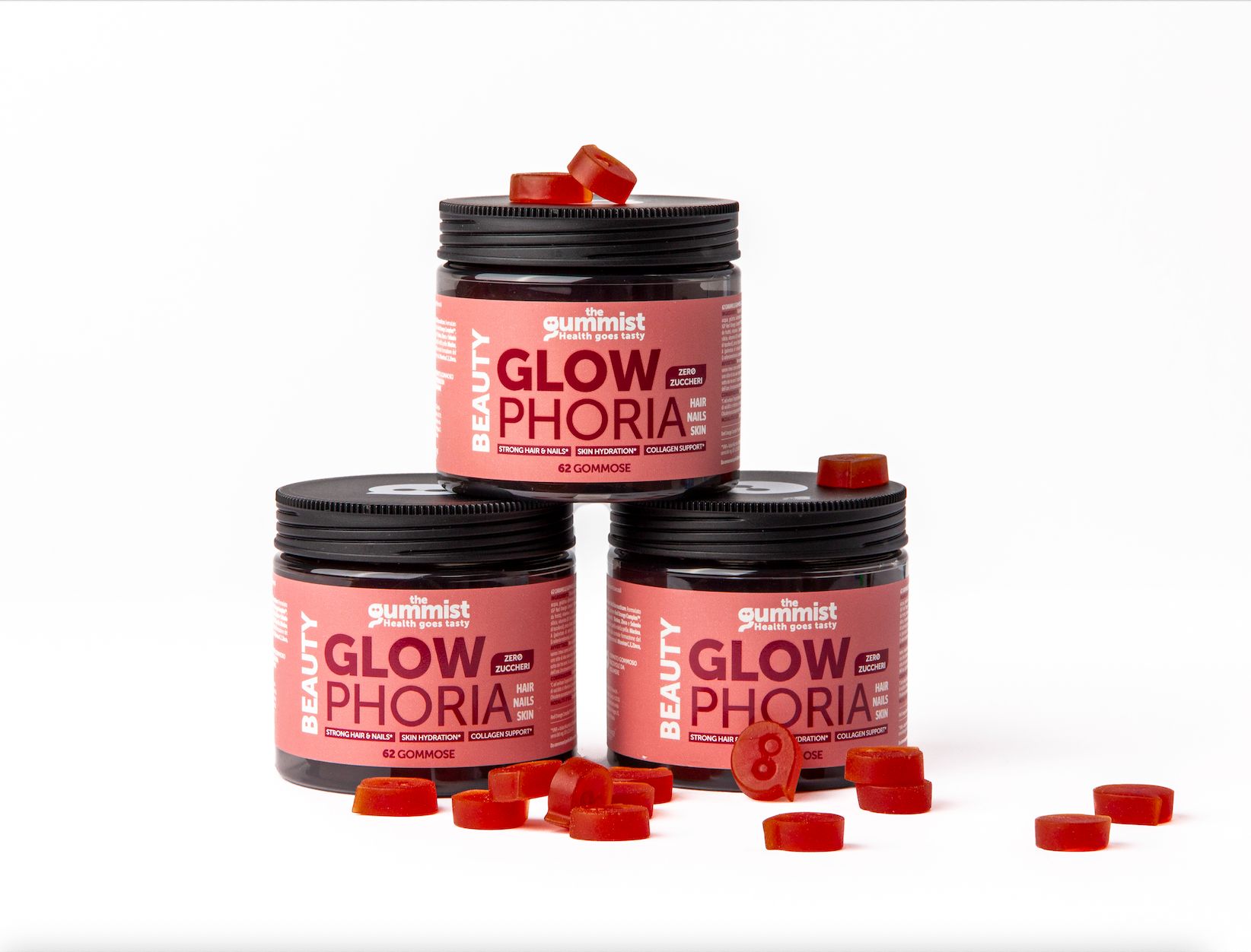 Tre barattoli di caramelle gommose. Scritta: Glowphoria. Caramelle gommose rosse accanto.