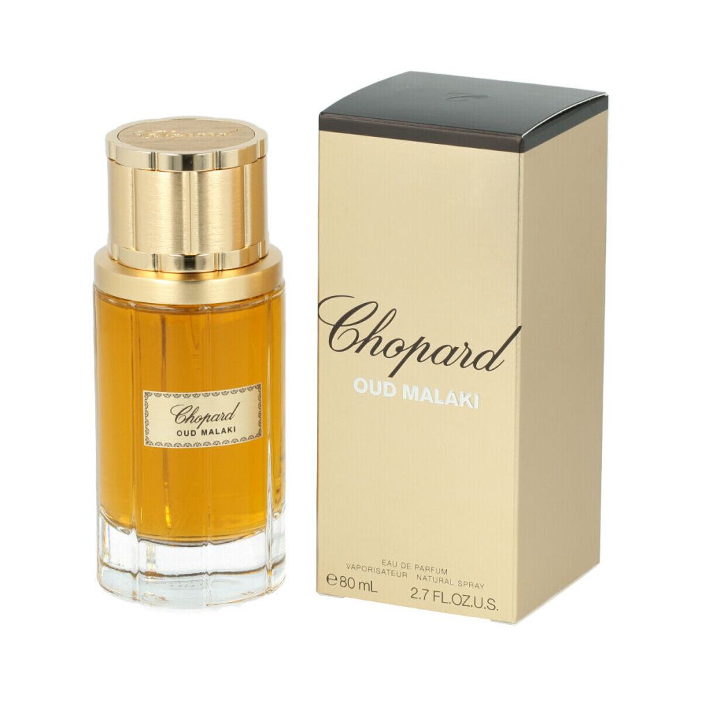 Flacone di profumo e confezione. Flacone dorato con tappo dorato. Scritta: Chopard Oud Malaki. Confezione con testo.