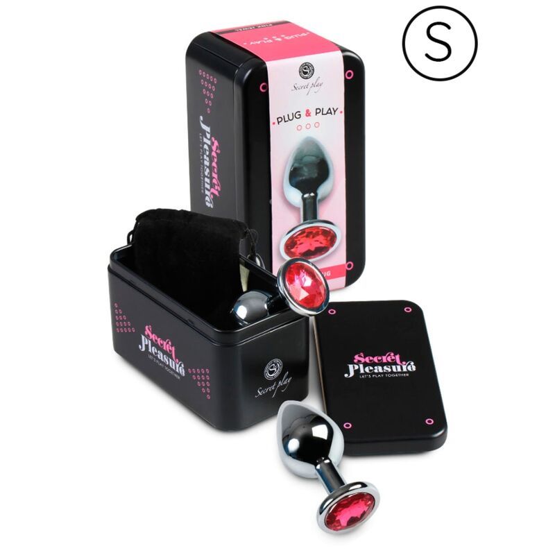 Confezione prodotto con due plug anali in metallo. Scatola nera, sacchetto nero, carta. Nome e logo del prodotto visibili.