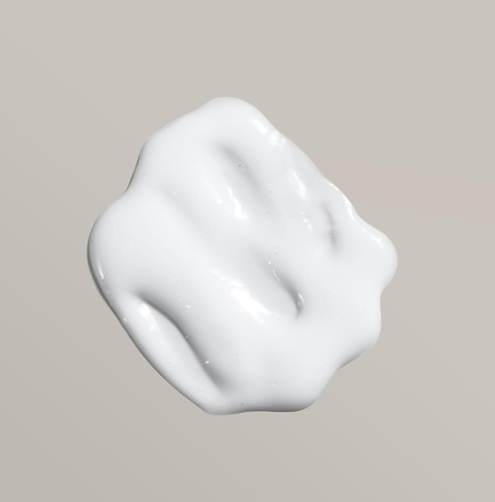 Crema bianca, forma ondulata su sfondo chiaro. Consistenza lucida.