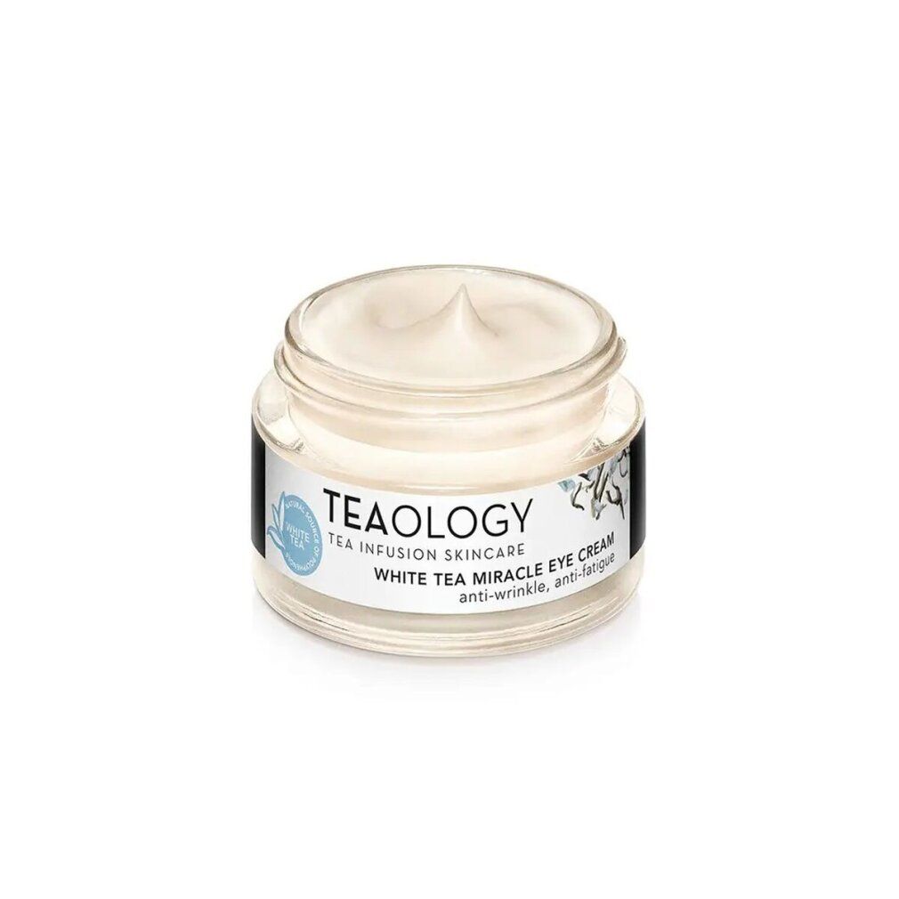 Piccolo vasetto di vetro con crema bianca. Scritta: TEAOLOGY, White Tea Miracle Eye Cream. Coperchio in vetro.